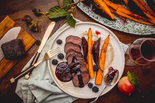 Venison loin fillet with blackberry sauce and roasted roots